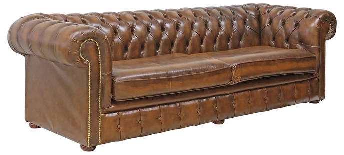 LARGE ENGLISH BUTTONED BROWN LEATHER CHESTERFIELD SOFA: Large English Chesterfield sofa, late 20th c., brown leather upholstery, button-tufted back and rolled arms, trimmed with brass nail-heads, two loose seat cushions,&nbsp;on bun feet, approx 29&quot;h,
