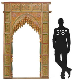 LARGE ARCHITECTURAL MOROCCAN PARCEL-GILT & CARVED MIHRAB WALL NICHE, 89"H: Architectural Moroccan Moresque mihrab wall niche panel, 20th c., polychrome painted throughout, elaborately carved and parcel-gilt arch on turned columnar supports, framed by recessed paneling with g