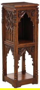 FRENCH GOTHIC REVIVAL CARVED OAK ALTAR NICHE/TABERNACLE CABINET: French Gothic Revival carved oak altar&nbsp;niche/ tabernacle cabinet, early 20th c., having two arched tiers with carved tracery and floral&nbsp;motifs, rising on platform base and bracket feet, appr