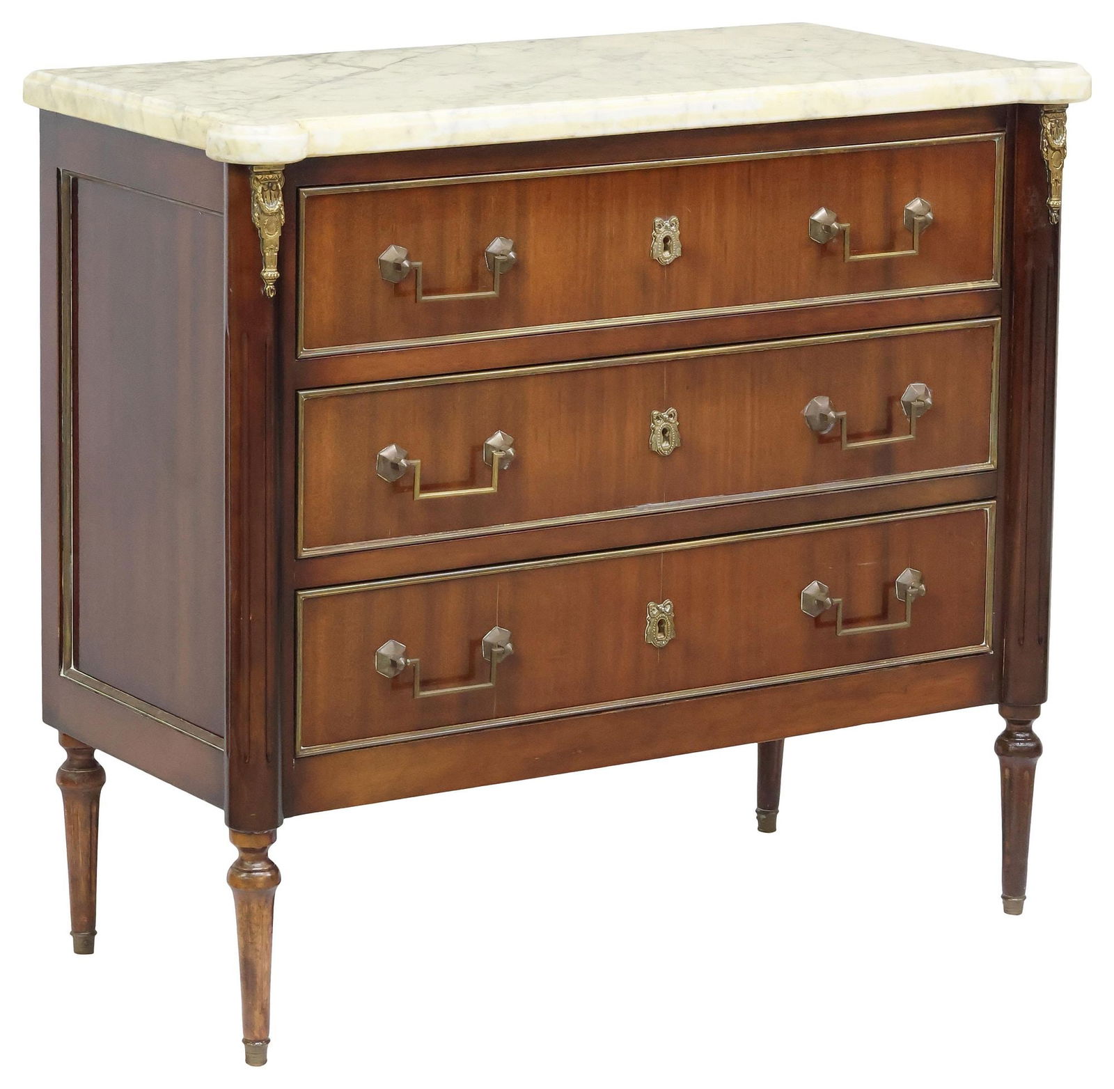 FRENCH LOUIS XVI STYLE MARBLE-TOP MAHOGANY COMMODE: French Louis XVI style mahogany commode, 20th c., having shaped marble top, above three drawers with gilt metal trim, flanked by fluted corner posts, rising on tapered legs, ending on brass cap feet,