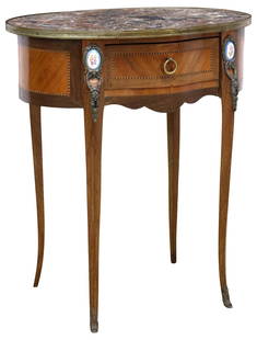 FRENCH LOUIS XV STYLE MARBLE-TOP MAHOGANY PORCELAIN-MOUNTED SIDE TABLE: French Louis XV style mahogany side&nbsp;table, 20th c., having inset ovular marble top, above single drawer, framed string inlay and mounted porcelain plaques,&nbsp;rising on transitional cabriole le
