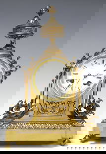 FRENCH LOUIS XVI STYLE JAPY FRERES BRASS MANTEL CLOCK: French Louis XVI style brass mantel clock, late 19th c., having urn-form finial, above stepped case with raised scrollwork motifs, central white enameled dial with Roman numeral hour markers, partiall