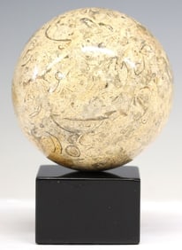 GEOLOGICAL MARBLE SPHERE ON BLACK MARBLE BASE