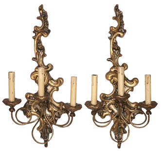 (2) ITALIAN LOUIS XV STYLE SILVER GILT 3-LIGHT WALL SCONCES: (pair) Italian Louis XV style silver-gilt three-light wall sconces, 20th c., each having scrolled foliate frame, issuing three gilt iron arms, terminating on faux candles,&nbsp;in need of wiring, appr