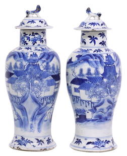 (2) CHINESE BLUE & WHITE PORCELAIN VASES & COVERS: (pair) Chinese blue and white porcelain vases,&nbsp;each having cover with figural foo lion finial, narrow neck over tapered body, with pagodas and architectural motifs in mountainous landscape, folia