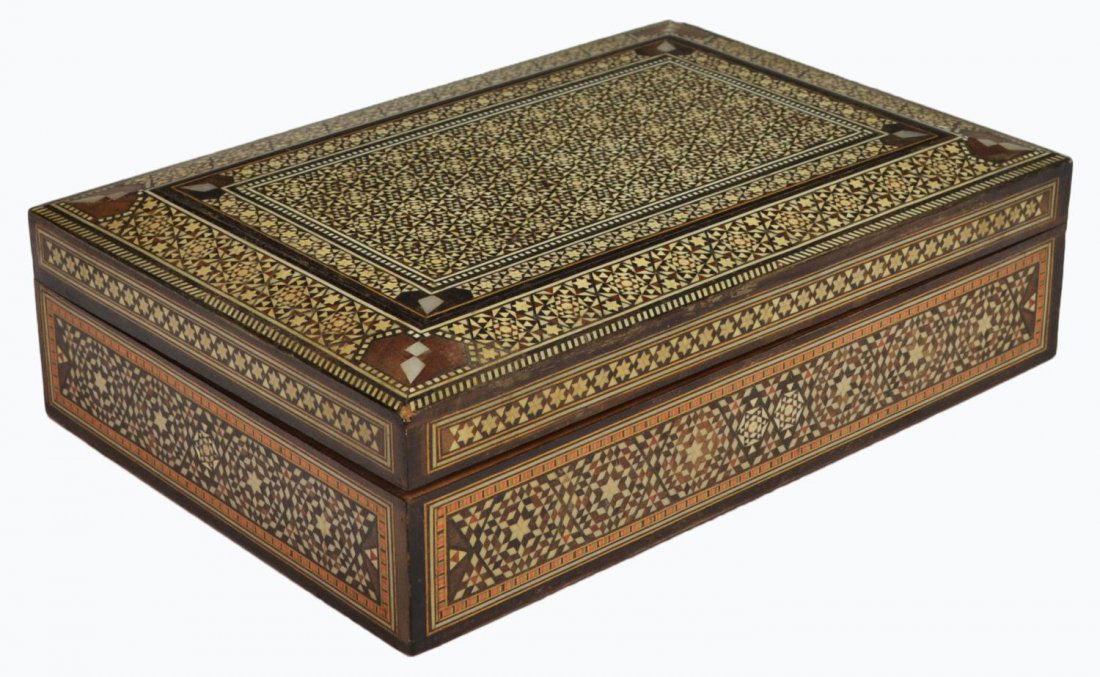VINTAGE ARABESQUE BONE INLAID TABLE BOX: Vintage arabesque inlaid table box, densely inlaid bone and mother-of- pearl throughout in a star form pattern, watermark to top, some loss with age, 3"h, 10.25"w, 7"d, 2lbs Start Price: $50.00
