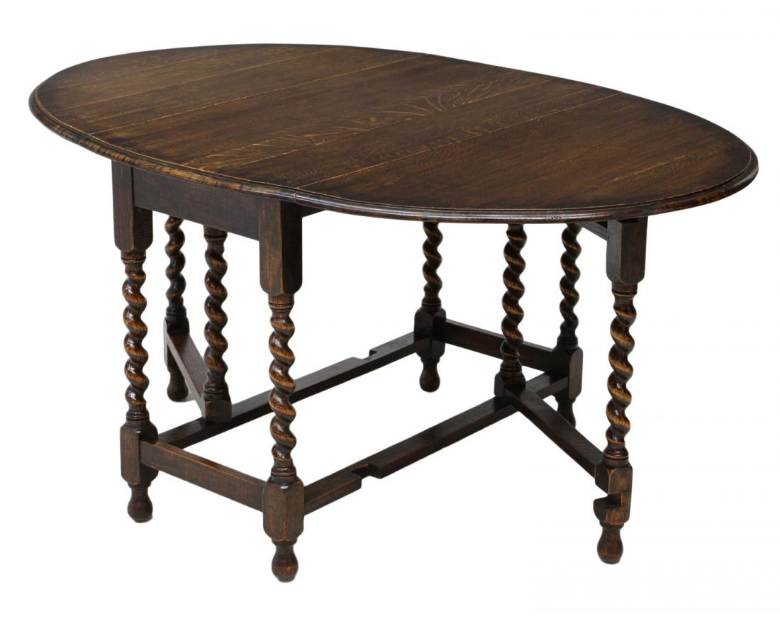 ENGLISH OAK TWIST LEG DROP LEAF TABLE: English oak drop leaf table, 20th c., raised on stretcher joined legs with ball feet, leaves raised forming oval: 59.5"w, leaves down: 29"h, 20.5"w, 41"d Start Price: $150.00