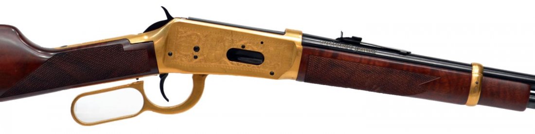 WINCHESTER COMMEMORATIVE CARBINE, ANTLERED GAME: Winchester Model 94 Antlered Game Commemorative rifle,.30-.30 Win caliber, lever action, 20" round barrel, gilt receiver and lever, left receiver engraved with deer, right receiver engraved with elk, 