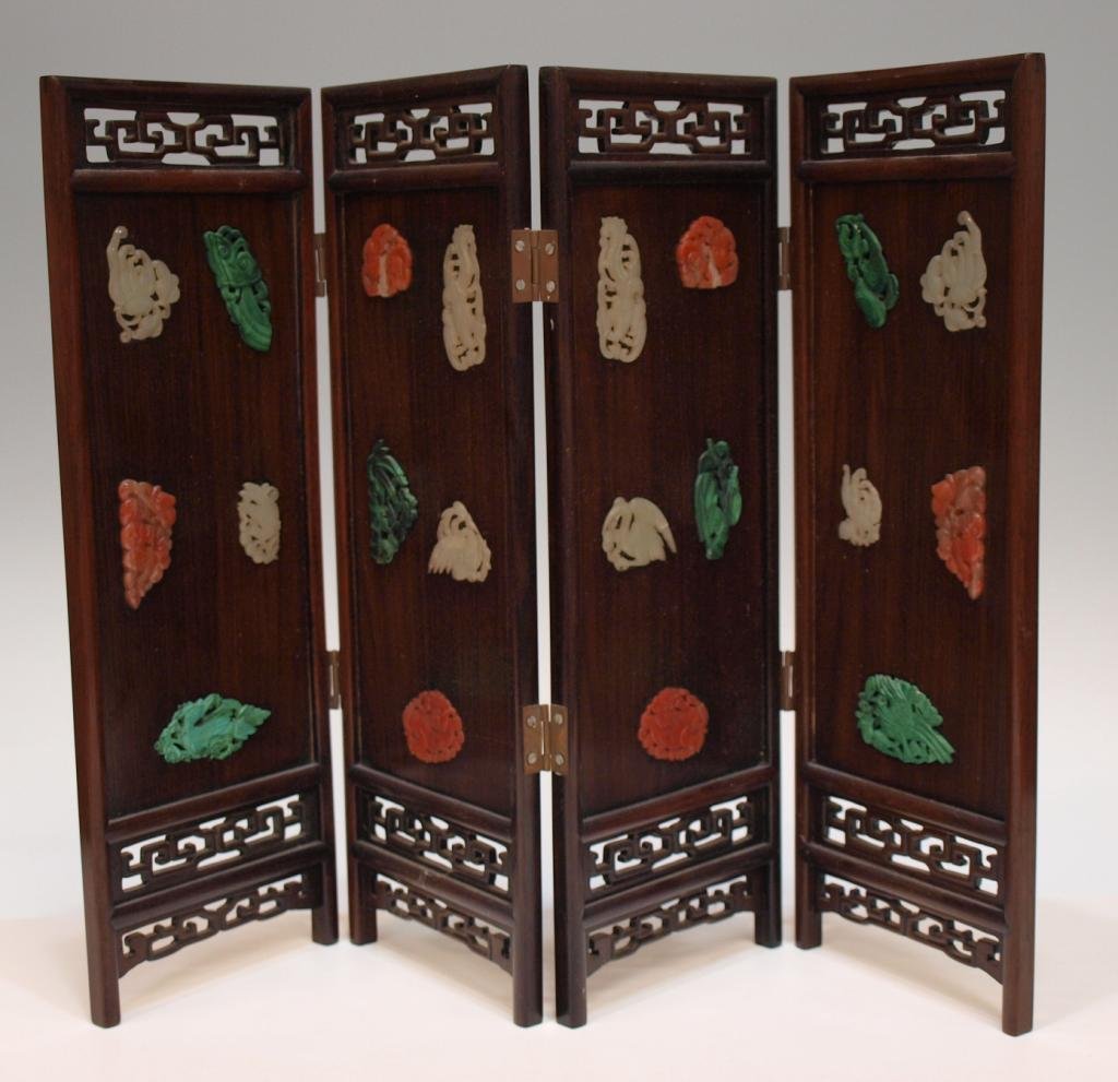 CHINESE TABLE SCREEN INLAID JADE & STONE PLAQUES: Chinese rosewood four-panel table screen inlaid with figural jade and hardstone plaques, 20th c., comprising five each of jade, malachite and carnelian, fret borders along top and base, 14.25"h, 20.5"