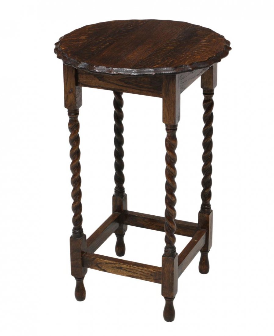 ENGLISH OAK CIRCULAR OCCASIONAL TABLE: English oak occasional table, 20th c., circular top with "pie crust" edge raised on twist supports joined by lower stretcher on turned feet, 27.75"h, 17.75"d Start Price: $60.00