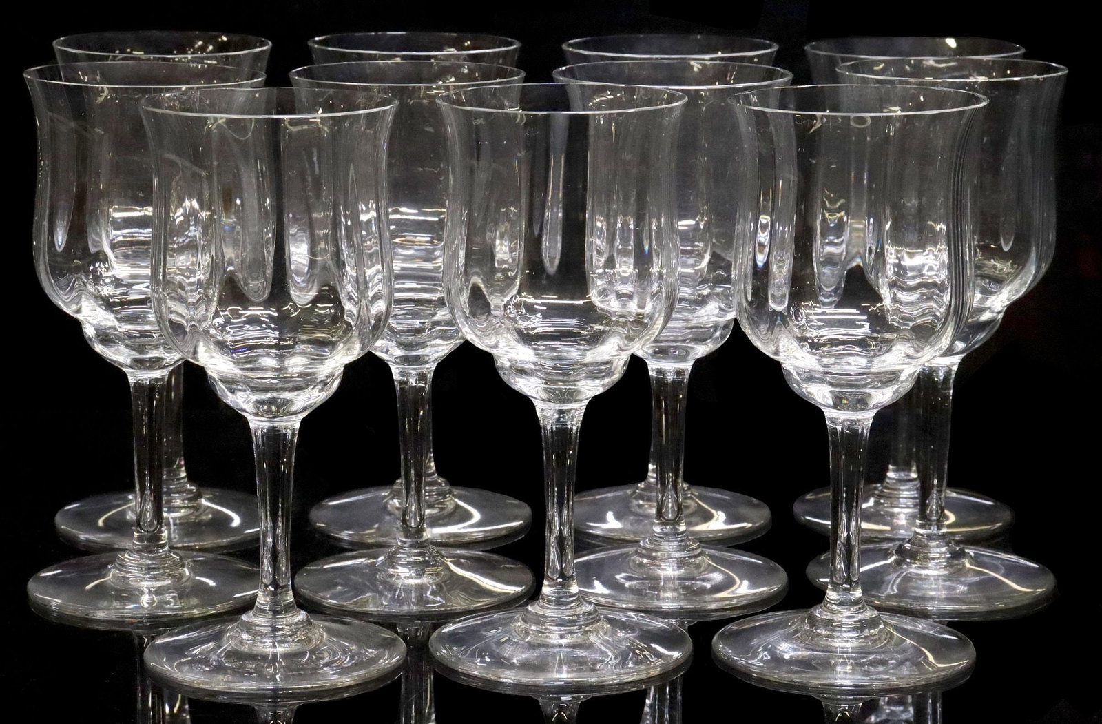 (11) FRENCH BACCARAT 'CAPRI' OPTIC CRYSTAL CLARET WINE STEMS: (lot of 11) French Baccarat crystal claret wine stems, in the "Capri" pattern, with optic fluted bowl, plain stem and foot, acid-etched maker's mark underfoot, approx 6"h, 2 5/8"diam, 3.25lbs total **