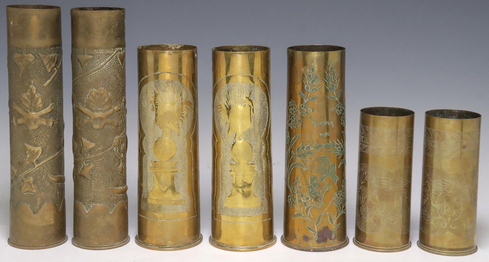(7) FRENCH WWI-ERA TRENCH ART ARTILLERY SHELL VASES: (lot of 7) French WWI-era trench art vases, fashioned from artillery shells, including: (pair) having incised rooster inscribed "Paix," standing atop pedestal in dotted surround, revers