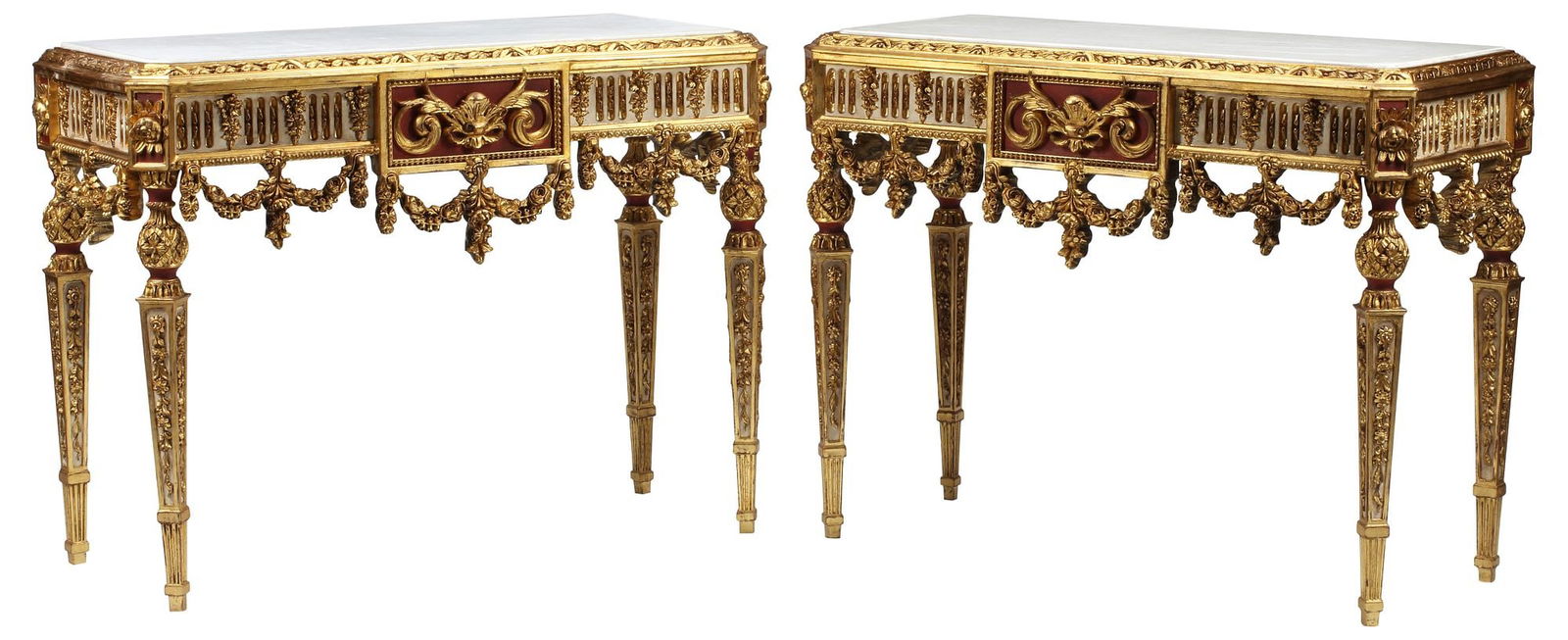 (2) NEOCLASSICAL STYLE MARBLE-TOP PARCEL GILT & PAINTED CONSOLE TABLES: (pair) Neoclassical style parcel-gilt and paint-decorated console tables, each having inset marble top, above fluted apron with draped floral swags, gray and red painted accents, rising on taperi