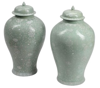 (2) CHINESE EARTHENWARE SLIP-DECORATED CELADON-GLAZED COVERED JARS