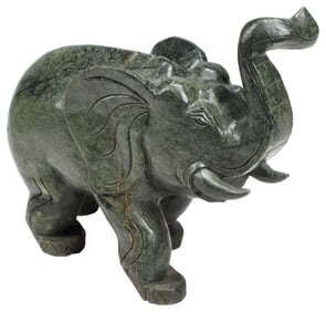 LARGE CARVED GREEN HARDSTONE MODEL OF AN ELEPHANT