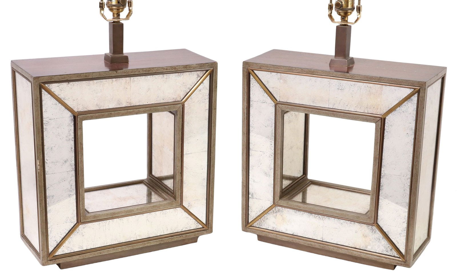 (2) MODERNIST ROMEO REGA STYLE MIRRORED CUBE 1-LT TABLE LAMPS: (pair) Modernist single-light table lamps, in the manner of Romeo Rega, 21st c., each having cubic finial, above hollow square frame, clad in antiqued mirror plates, on integral raised platform, accom