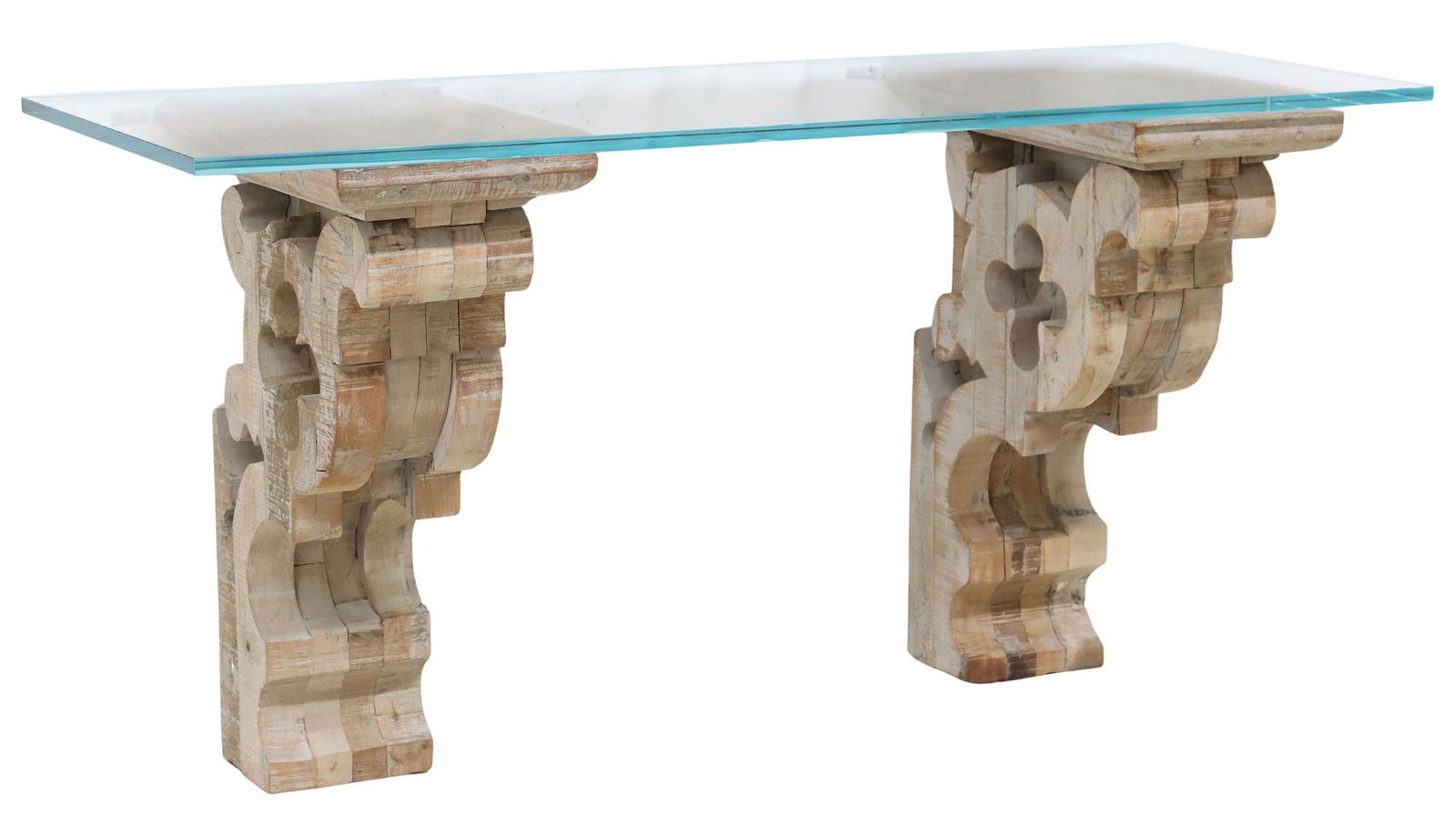 RESTORATION HARDWARE CONSOLE TABLE WITH LARGE GOTHIC-STYLE CORBELS: Wall-mounted console table, attributed to Restoration Hardware, 21st c., rectangular tempered glass shelf, supported by a pair of large carved wood architectural corbels, each scrolled bracket with an