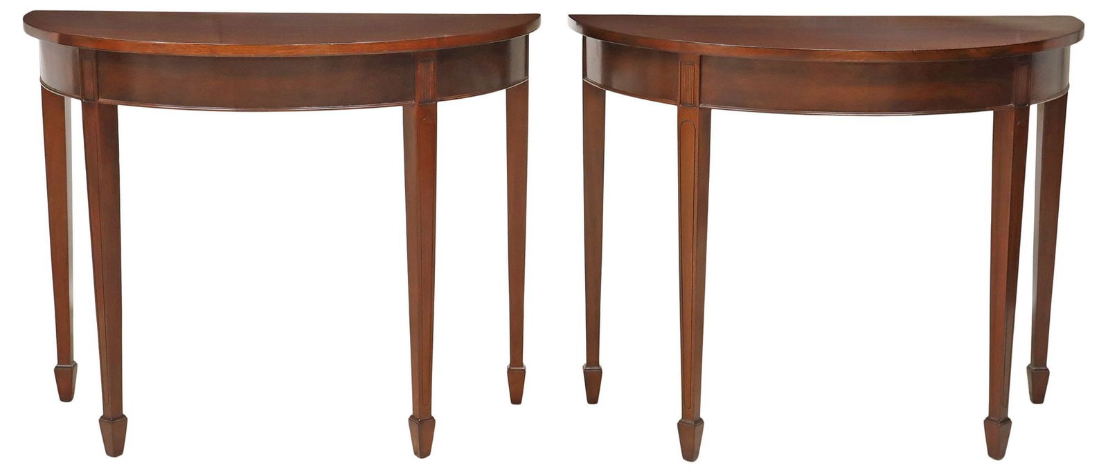 (2) ENGLISH HEPPLEWHITE STYLE MAHOGANY DEMILUNE CONSOLE TABLES: (pair) English Hepplewhite style mahogany demilune console tables, early 20th c., each having shaped top, rising on tapering squared legs, ending on spade feet, hinged hook under each top converts the