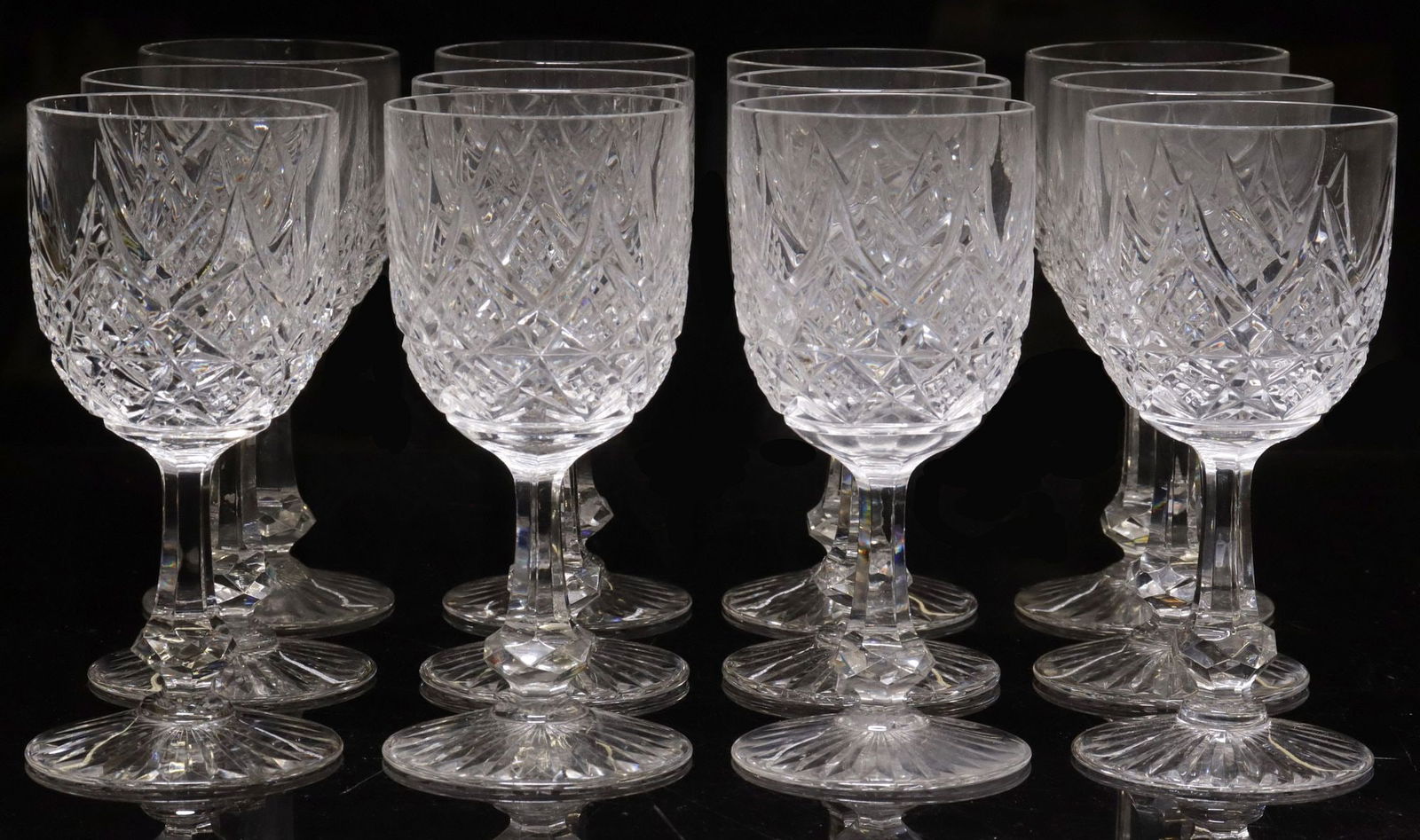 (12) BACCARAT 'COLBERT' CRYSTAL PORT WINE GLASSES: (lot of 12) French cut crystal port wine glasses, Baccarat, in the "Colbert" pattern, cut bowl with pointed spires, paneled stem with a faceted knop, on a star-cut foot, acid-etched maker's mark, appr