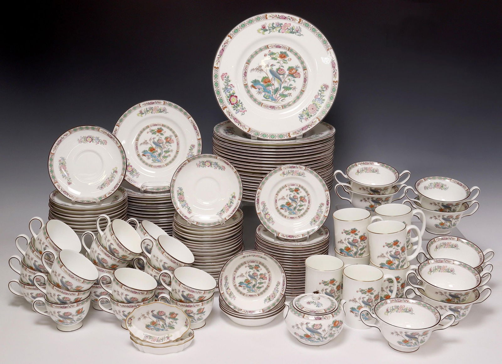 (148) WEDGWOOD 'KUTANI CRANE' CHINA DINNER SERVICE: (lot of 148) English bone china partial dinner service, Wedgwood, in the "Kutani Crane" pattern, each with varied maker's mark underfoot, including: (21) dinner plates, approx 10.75"diam; (29) salad p