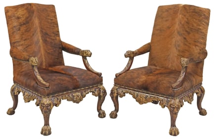 (2) THEODORE ALEXANDER COWHIDE-UPHOLSTERED PARCEL-GILT ARMCHAIRS