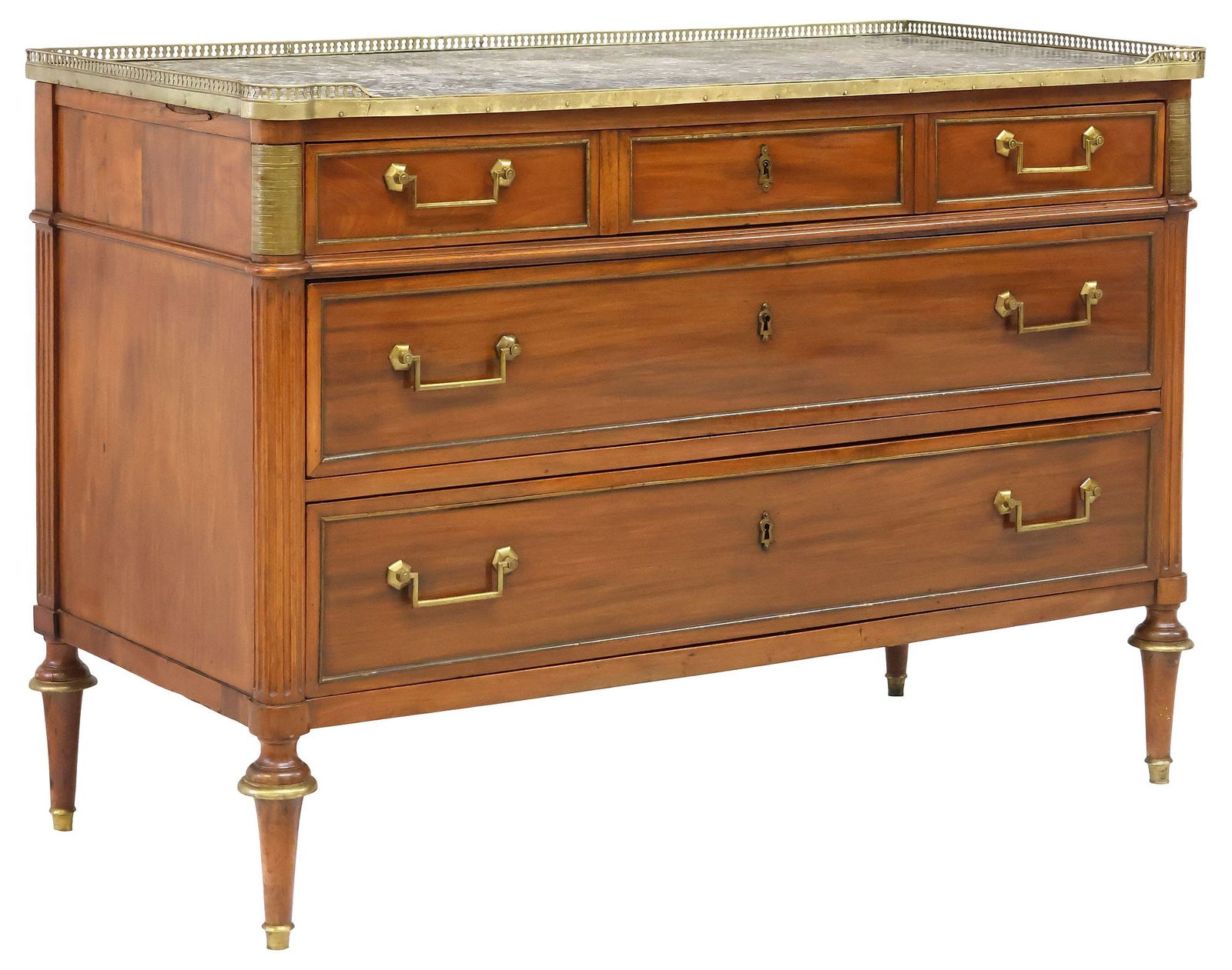 FRENCH LOUIS XVI STYLE MARBLE-TOP MAHOGANY COMMODE: French Louis XVI style mahogany commode, late 19th c., pierced gilt-metal gallery enclosing the marble top, three graduated long drawers, framed by fluted posts, on tapered legs, marble top intact wit