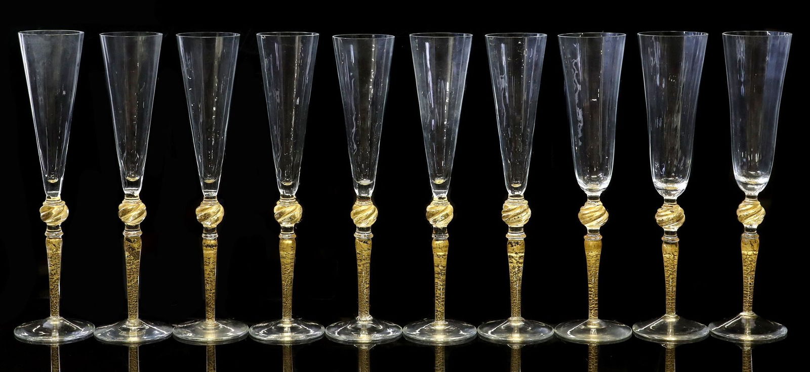 (10) CENEDESE & MORETTI MURANO ART GLASS CHAMPAGNE FLUTES: (lot of 10) Venetian Murano art glass champagne flutes, an assembled set with slightly varied bowls, Giovanni Cenedese (Italian, b.1946) and Carlo Moretti (Italian, 1934-2008), each rising on spiral-t