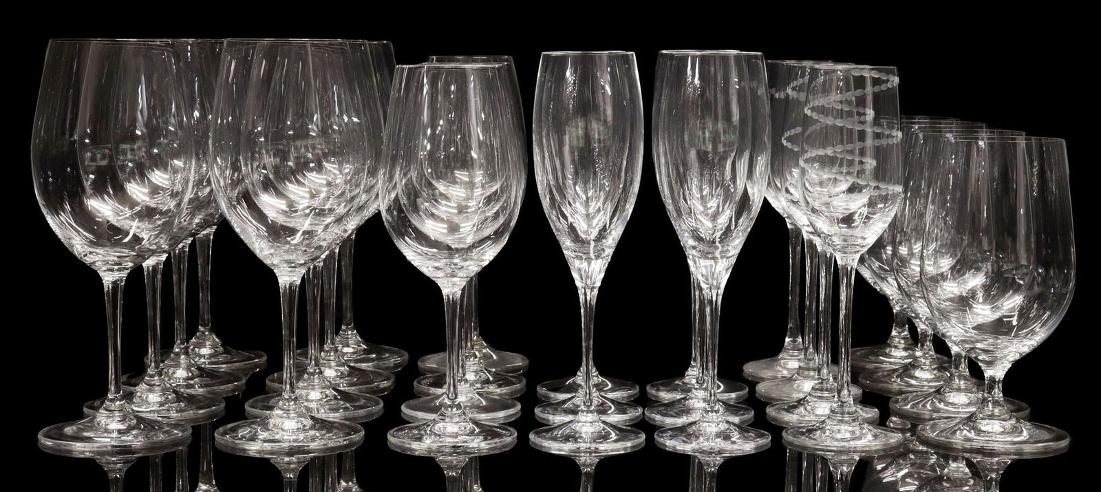 (26) COLLECTION OF RIEDEL COLORLESS STEMWARE: (lot of 26) Riedel colorless stemware, all with acid-etched maker's mark, including: (8) all purpose red wine glasses, (one) with some fleabites to base, approx 9"h, 3.5"diam; (6) champagne flutes, ap