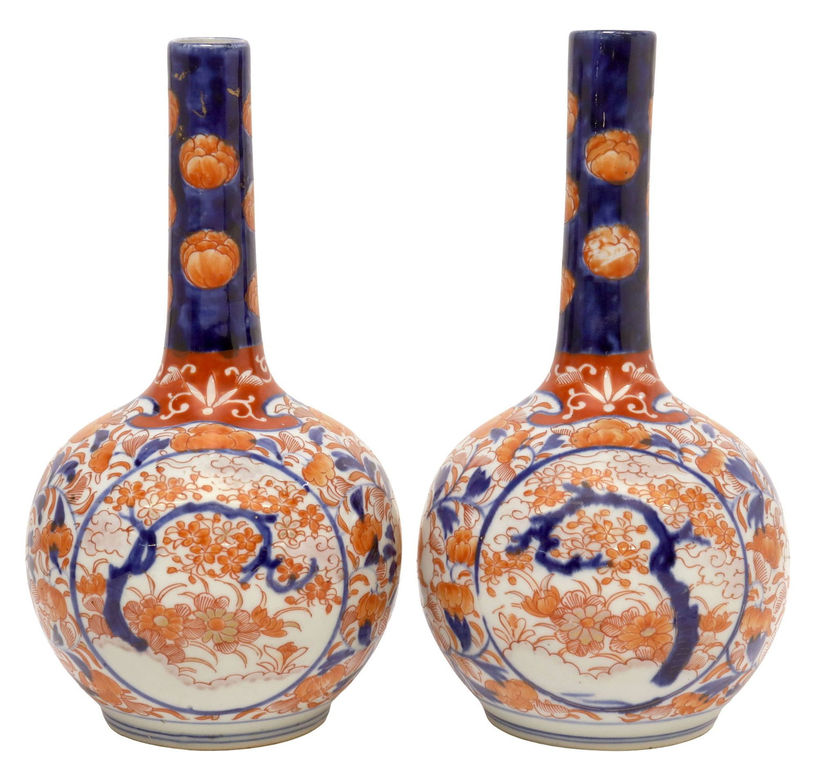 (2) JAPANESE IMARI PALETTE PORCELAIN BOTTLE VASES: (pair) Japanese Imari palette porcelain bottle vases, each having narrow neck over bulbous body, decorated with flowering trees and floral motifs, approx 10.5"h, 5.5"diam, 3.25lbs total