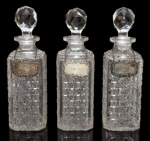 (3) EDWARDIAN CUT-CRYSTAL DECANTERS AND STOPPERS