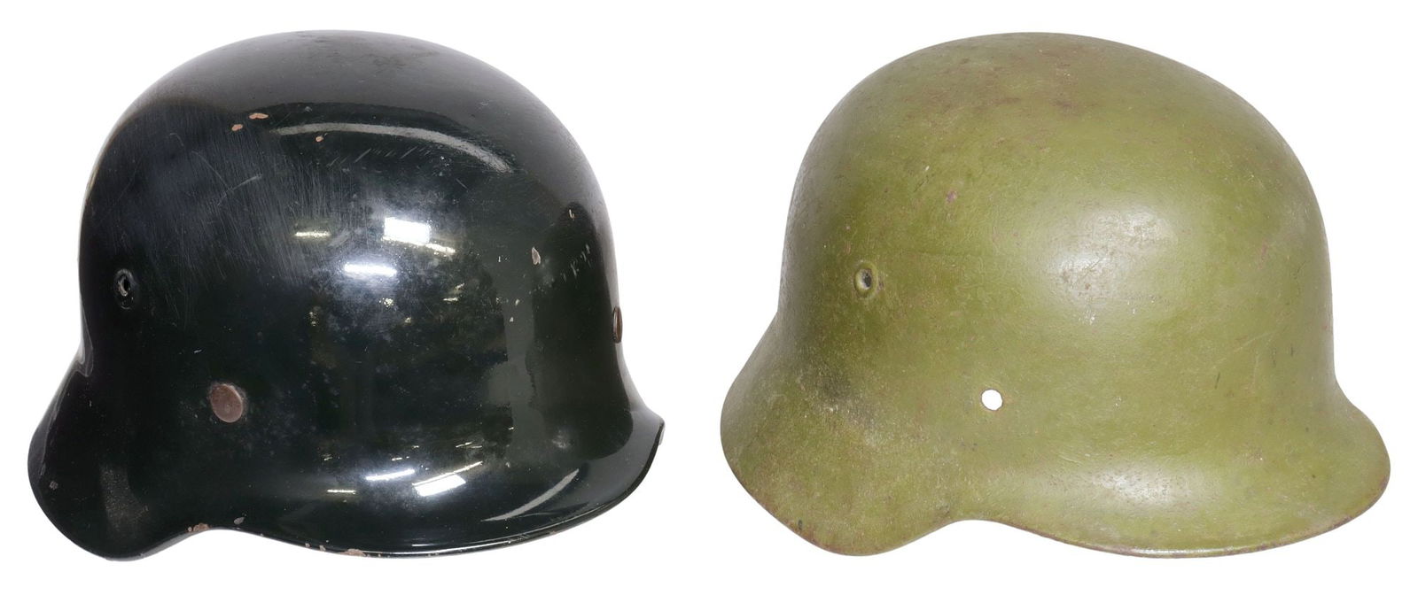 (2) GERMAN MODEL 1935 MILITARY HELMETS: (lot of 2) German Model 1935 Helmets: (1) German WWII Steel Helmet, model 35, green, manufactured 1935-1940, retains the worn Army mark of the German eagle clutching a swastika, the helmet rim rolled