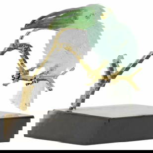 MANFRED WILD (B.1944) AQUAMARINE, TOURMALINE & SILVER-GILT TOUCAN: Silver-gilt and lapidary model of a bird, Manfred Wild (German, b.1944) for Emil Becker KG, Idar-Oberstein, toucan carved from aquamarine with a tourmaline beak, perched on a silver-gilt branch,