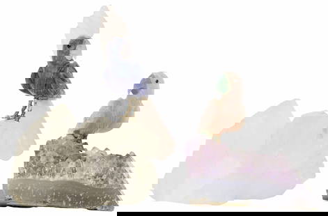 (2) CARVED GEMSTONE BIRDS COCKATOO & PARROT: (lot of 2) Carved gemstone models of birds, likely from Brazil, including: (1) cockatoo perched on a rock crystal base, approx 4"h, (1) parrot perched on an amethyst base, approx 2.75"h; 1lb total