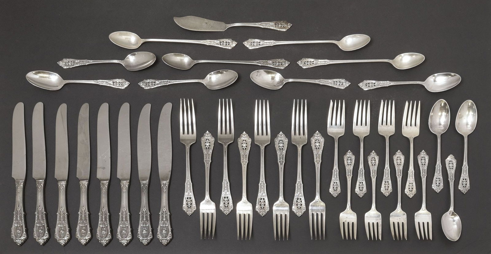 (37) WALLACE 'ROSE POINT' STERLING SILVER FLATWARE SERVICE: (lot of 37) American sterling silver flatware service, Wallace Silversmiths, in the "Rose Point" pattern, designed by William S. Warren (1888-1965), including: (6) French hollow handle knives, 9.75"l,