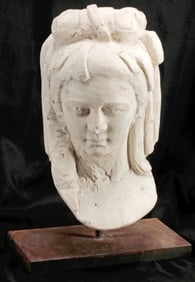 CARVED WHITE MARBLE FEMALE BUST ON AN IRON BASE