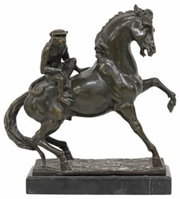 PATINATED BRONZE SCULPTURE OF A MONKEY ON HORSEBACK