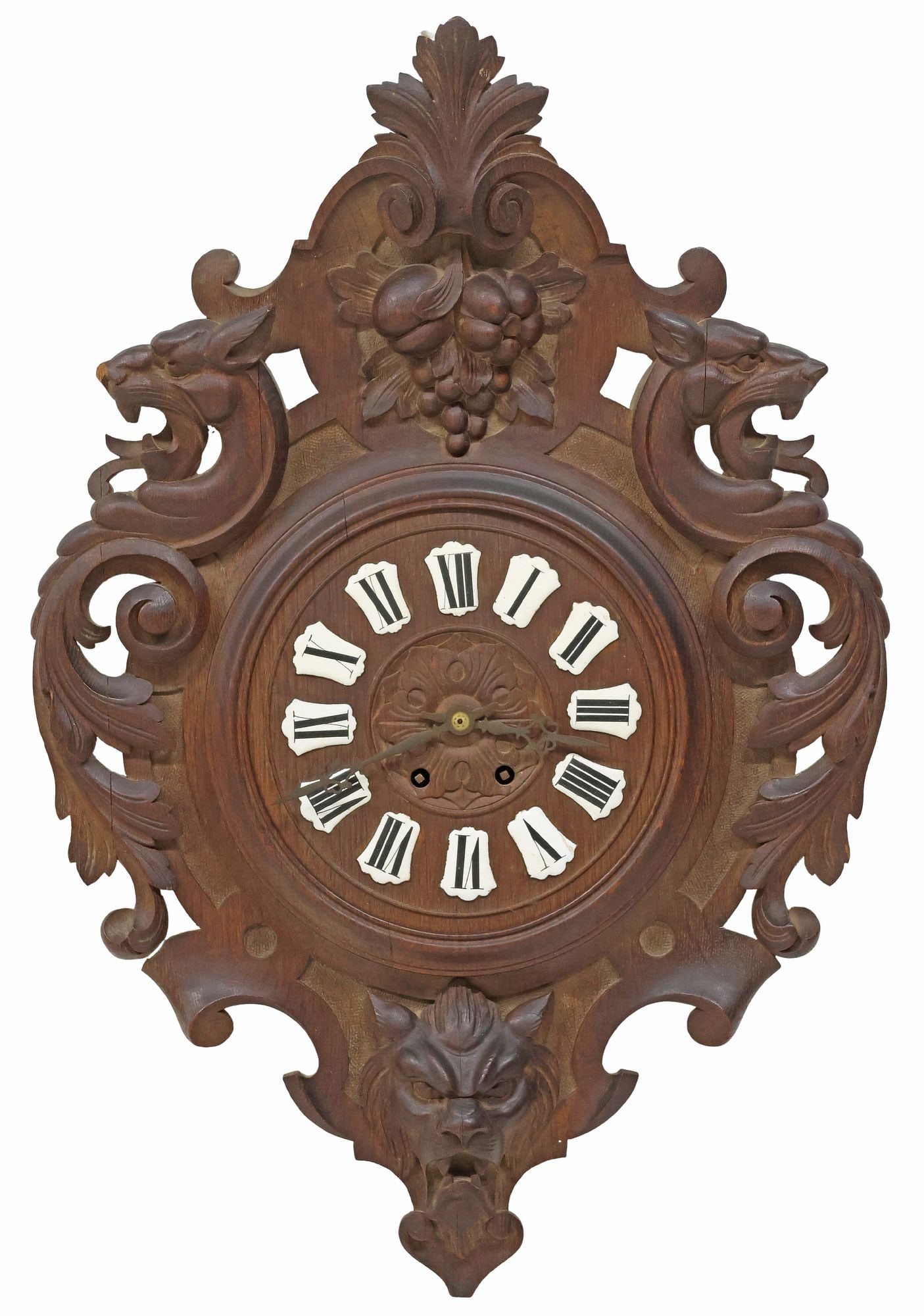 FRENCH RENAISSANCE REVIVAL CARVED OAK WALL CLOCK: French Renaissance Revival carved oak wall clock, late 19th c., having fanned foliate crest, above scrolled frame with grotesque masks and fruit motifs, centering dial with porcelain Roman numeral hou