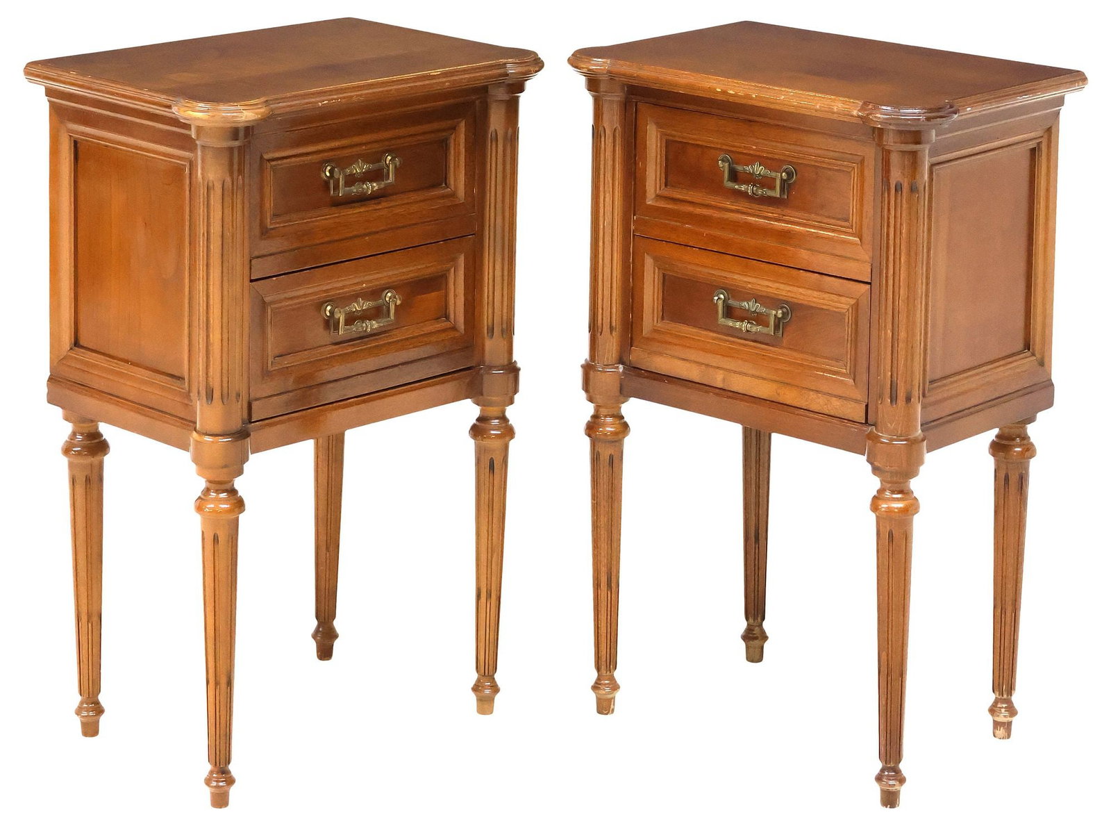 (2) FRENCH LOUIS XVI STYLE 2-DRAWER FRUITWOOD NIGHTSTANDS: (pair) French Louis XVI style fruitwood nightstands, 20th c., having shaped top, over two drawers, rising on fluted tapering legs, ending on arrow feet, one intact with repair to front corner, approx 