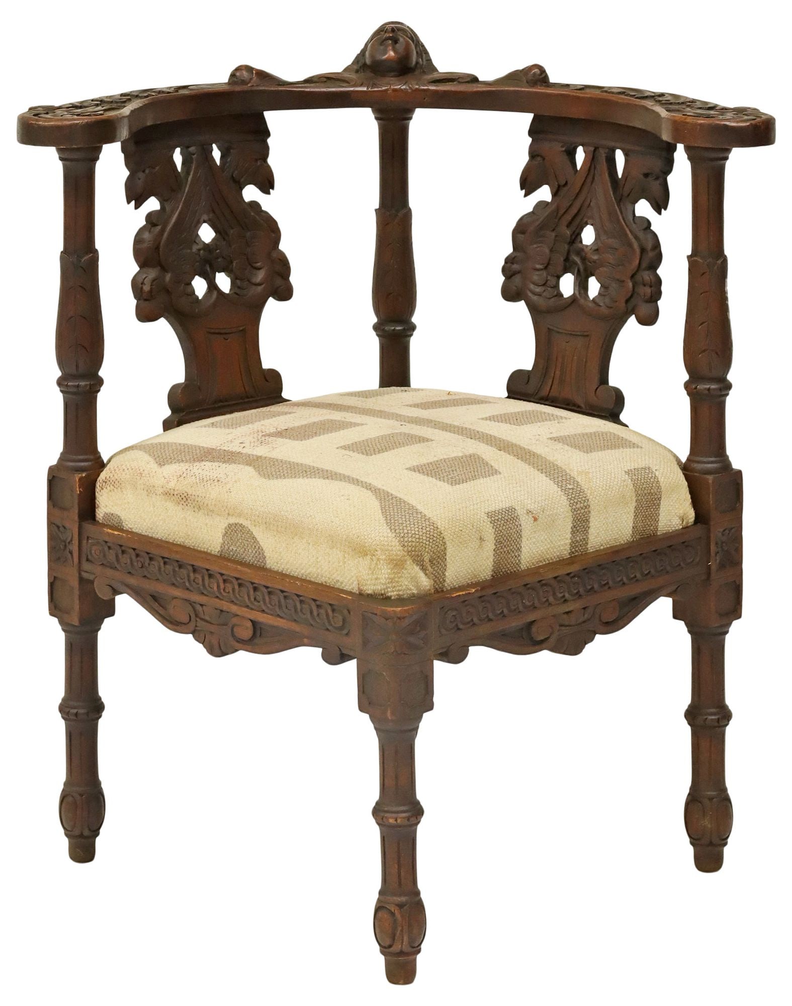 FRENCH RENAISSANCE REVIVAL WALNUT CORNER CHAIR: French Renaissance Revival carved corner chair, late 19th/ early 20th c. having rounded top rail, with carved scrollwork and central protruding mask, pierced griffin-form splats, removable padded seat