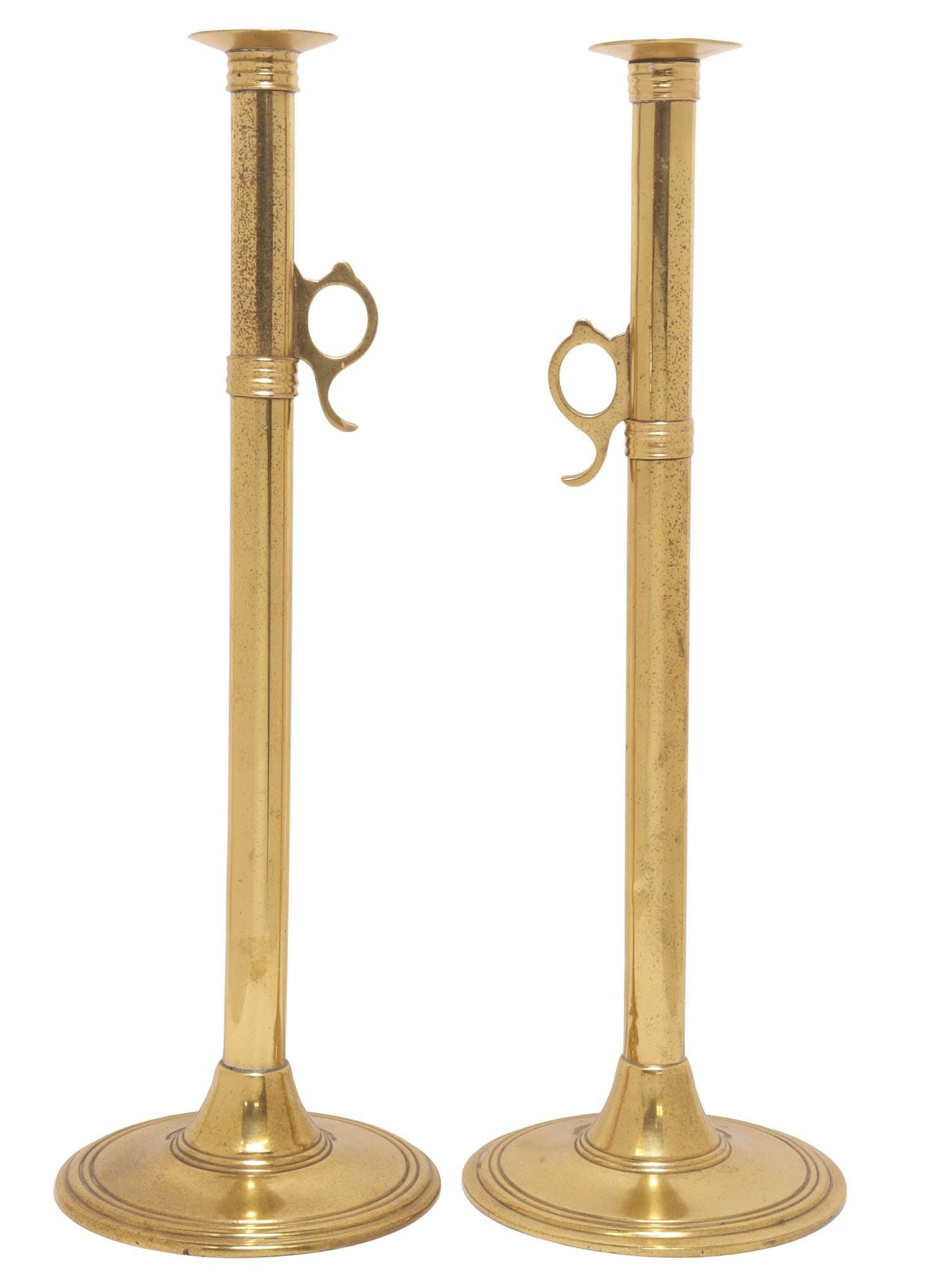 (2) ENGLISH BRASS 'CANNON BARREL' TELESCOPIC CANDLESTICKS: (pair) English brass candlestick holders, 19th c., each with gently curved bobeche, tubular standard equipped with a cannon-blast ejector controlled by the handle at side, rising on ribbed circular ba