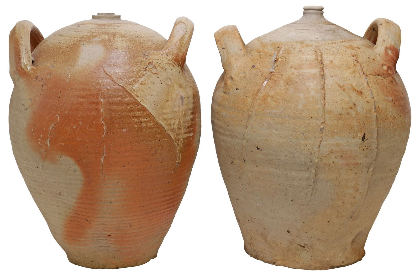 (2) FRENCH PROVINCIAL STONEWARE OIL JUGS: (lot of 2) French Provincial stoneware oil jugs, each with dual side handles over tapered body, with slip-decorated linework, one with loss to rim and denting to side, largest: approx 17.5"h, 12"diam,