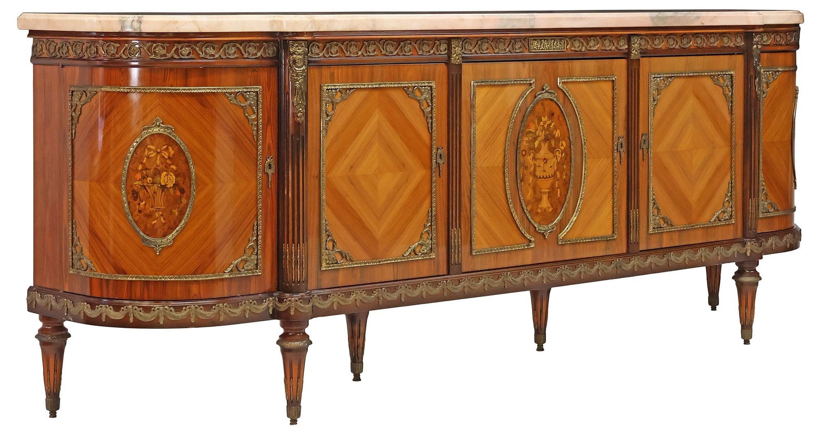 FRENCH LOUIS XVI STYLE MARBLE-TOP MARQUETRY SIDEBOARD: French Louis XVI style matched veneer demilune sideboard, 20th c., having pink marble top, above breakfront case with gilt-metal rinceau frieze, fitted with five cabinet doors, with central framed med