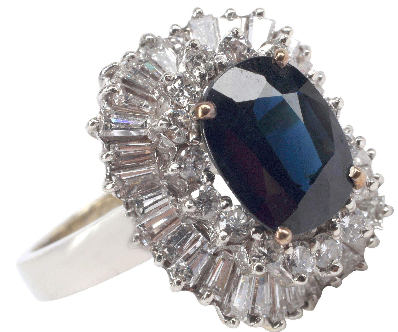 ESTATE 14KT WHITE GOLD SAPPHIRE & DIAMOND BALLERINA RING: Estate 14kt white gold ballerina ring, centering a cushion-cut sapphire, approx 4.25cts, in a surround of round brilliant-cut and tapered baguette diamonds, approx 2.05cttw, average color: H-I, averag