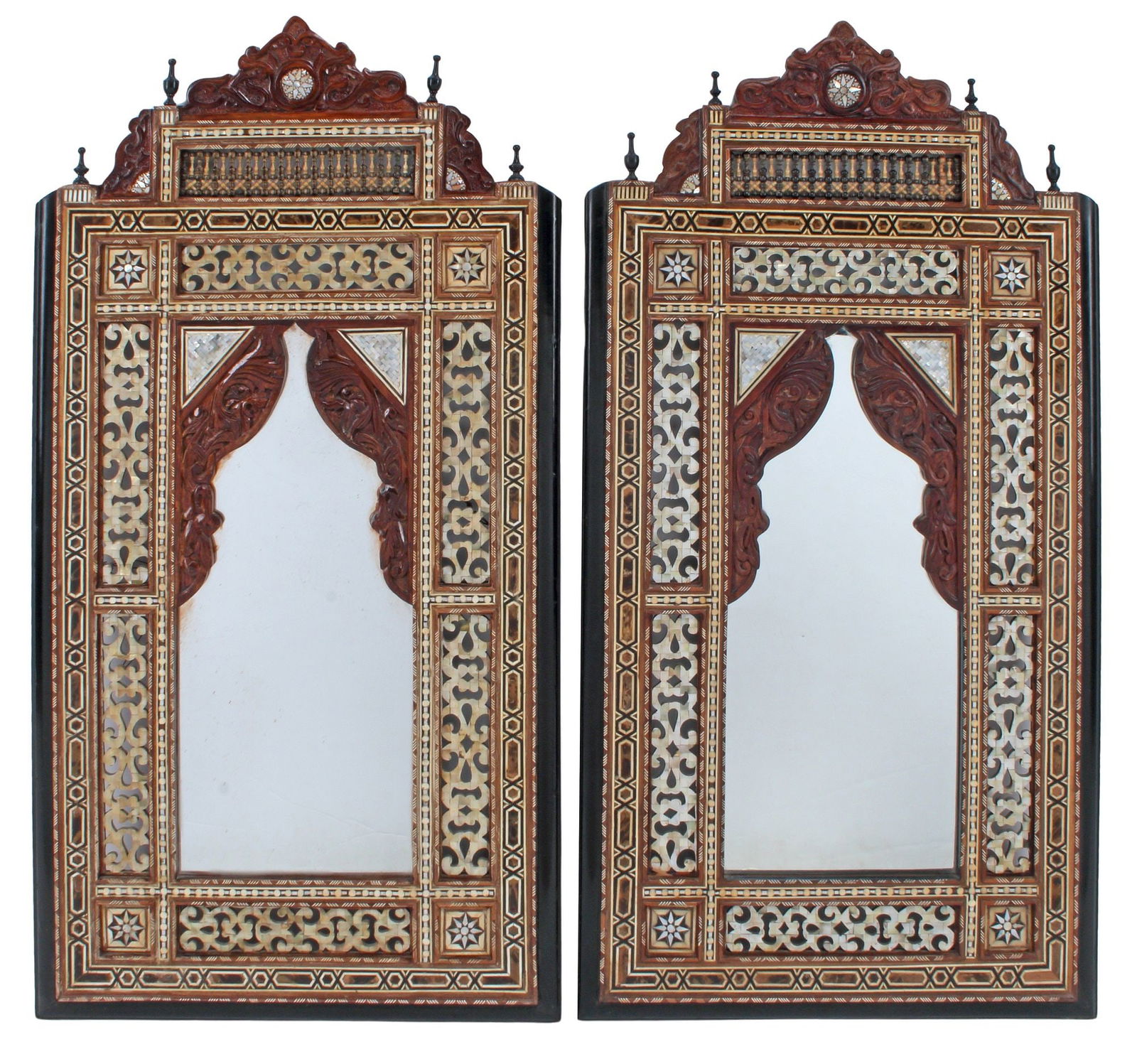 (2) MOORISH STYLE CARVED & SHELL-INLAID MIRRORS, 50.5"H: (pair) Large Moorish style carved and inlaid mirrors, each having architectural case with mosaic shell inlay, encasing flat mirror plate, approx 50.5"h, 26"w, 42lbs total