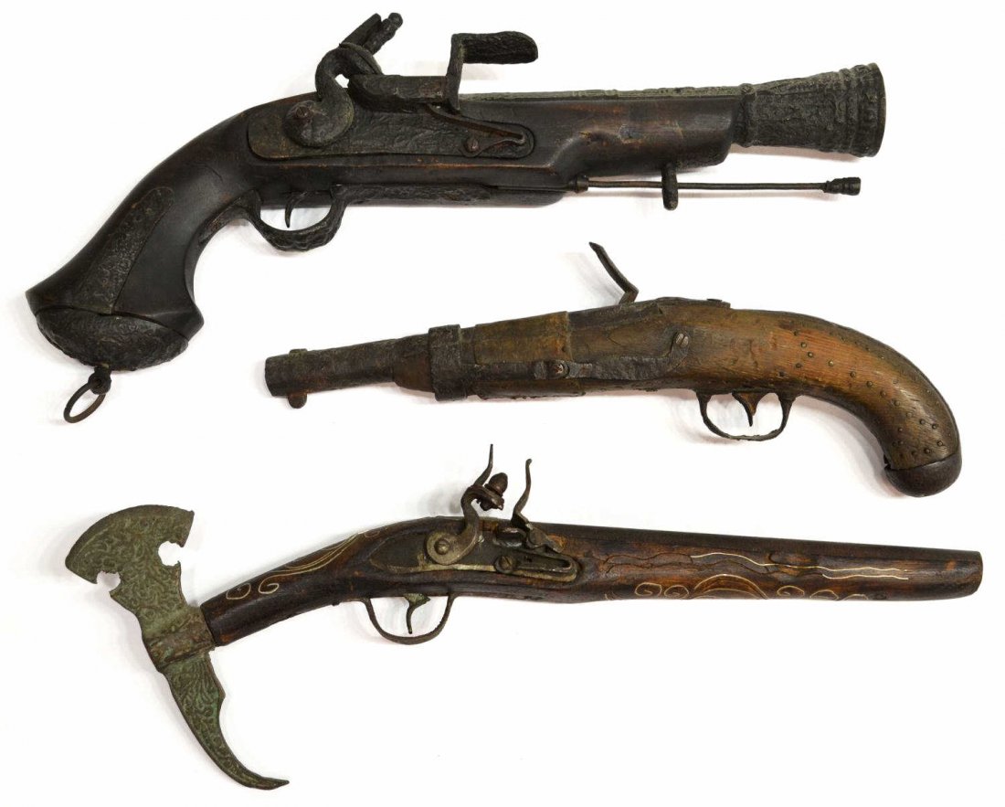 (3) CANNON & FLINT LOCK PISTOL REPLICA FIREARMS: (lot of 3) Collection of replica flintlock pistols, comprising: (1) gun with wire inlay and axe handle, 19"l; (1) having brass nail decoration with a leather and metal band, 15"l; (1) large pistol, fo