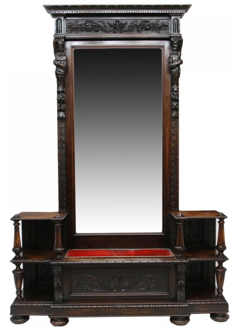 ANTIQUE ITALIAN RENAISSANCE REVIVAL ETAGERE: Italian Renaissance Revival etagere, c. 1900, a stepped cornice with foliate carved frieze over the large central beveled mirror flanked by carved figures, the lower section display shelves flanking a
