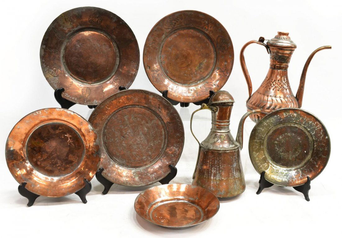 (8) MIDDLE EASTERN COPPER EWERS & CHARGERS: (lot of 8) Collection of Middle Eastern antique copper plates, dishes and ewers, some incised with foliate decoration, some wear and denting overall with age, largest: 13.25"h, 12lbs total Start Price