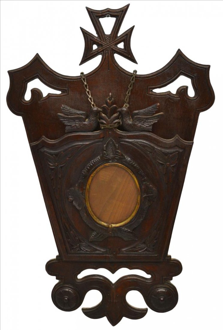 VICTORIAN CARVED WALNUT LETTER RACK: Victorian carved walnut letter rack, central glass faced picture frame, enclosed by carved foliates, mounted by two love birds, some splits with age, 25.5"h, 15.5"w, 2.75lbs Start Price: $80.00