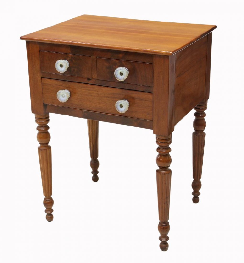 AMERICAN MAPLE FINISH WORK TABLE: American maple finish work table, c. 1900, rectangular top over two short drawers and one long drawer, all with later pulls, turned and ribbed legs on ball feet, 28"h, 21.75"w, 17.25"d Start Price: $8