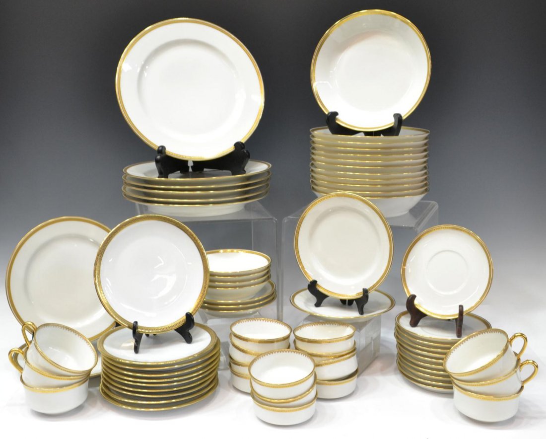 (67) ASSEMBLED GILT PORCELAIN DINNERSERVICE: (lot of 67) Haviland Limoges porcelain partial dinner service, an assembled set, gilded rims with geometric motif on a white ground, comprising: (6) dinner plates, 9.5"diam.; (2) salad plates, 7.5"dia